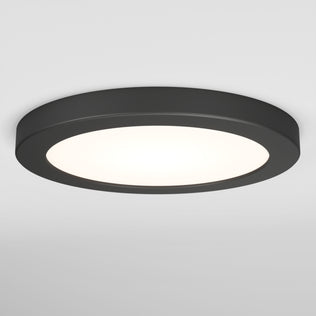 The Artika Europa Disk 7 in. LED modern flush mount light features a sleek, round black design with a flat profile and bright white center, perfect for mounting on a white ceiling, and offers 3 selectable color temperatures (CCT).