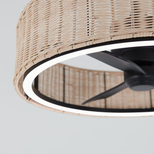 A close-up of the Artika Kalani 24 in. LED modern ceiling fan with black blades, circular light, woven rattan-style shade, and remote, showcased against a plain white background.