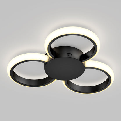 The Artika Nyala 15 in. LED flush mount light features three black circular rings with soft white illumination, arranged in a triangular pattern, making it a modern ceiling fixture for any space.