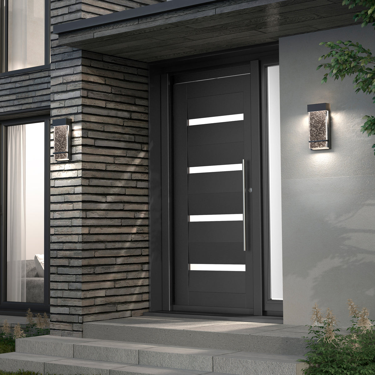Modern front entrance with a sleek dark door featuring horizontal glass panels, surrounded by brick and concrete walls. Two contemporary wall lights are illuminated on either side of the doorway.