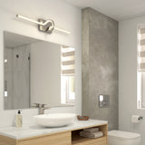 Modern bathroom with a round vessel sink on a wooden vanity, wall-mounted faucet, large mirror, minimalist light fixture, toilet, and striped window blinds. Neutral colors and clean lines create a sleek design.