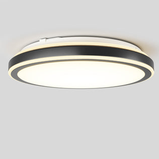 The Artika Altitude 15 in. LED modern flush mount light features a black and gold trim, shining brightly against a plain light gray background.