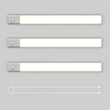 Three rectangular LED light bars with silver ends are arranged horizontally above a single white USB charging cable with connectors on both ends, all placed on a light gray background.