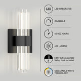 A modern wall sconce with vertical LED tubes and a black rectangular base. Icons and text highlight features: LED integrated, dimmable, 50,000 hours, 600 lumens, easy installation, and selectable white technology.