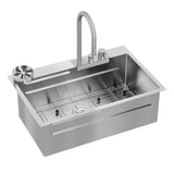 A modern stainless steel kitchen sink with a tall curved faucet, a built-in drainboard, control knobs, and a metal rack at the bottom of the basin.