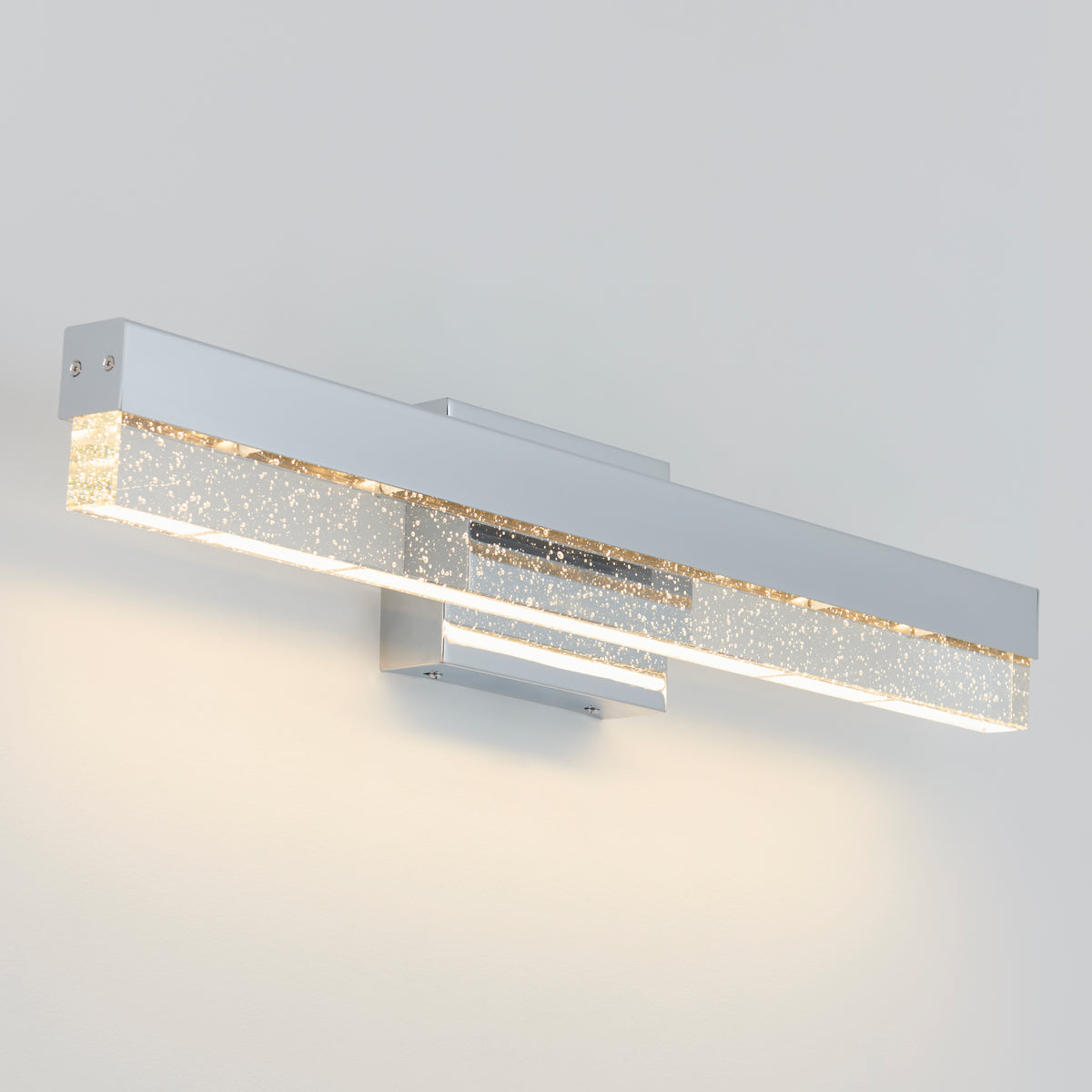Artika Essence Bubble Bar LED bathroom vanity light features a chrome finish and crystal accents, brightening any white wall.