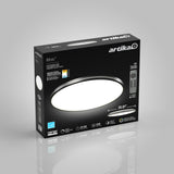 A black Artika Athos LED ceiling light box with an image of a round white light, remote control, features, and dimensions (20.87 inches) displayed on the packaging.