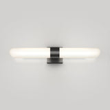 Minimalist wall-mounted light fixture with a horizontal frosted glass tube and a central black rectangular base, glowing softly against a plain light gray background.