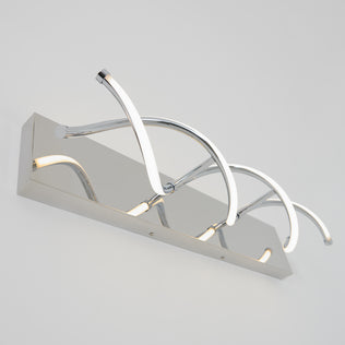 The Artika DNA modern LED bathroom vanity light features three curved illuminated arms on a sleek rectangular chrome base.