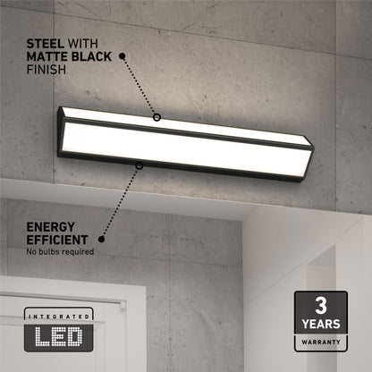 Artika’s Preston LED modern bathroom vanity light 3 CCT, finished in matte black, is mounted above a doorway on a gray wall. This energy-efficient fixture needs no bulb replacements and comes with a 3-year warranty.