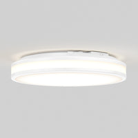 Artika Hemisphere 15″ LED flush mount ceiling light features 5 CCT adjustable brightness, glowing softly on a light gray ceiling.
