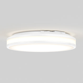 Artika Hemisphere 15″ LED flush mount ceiling light features 5 CCT adjustable brightness, glowing softly on a light gray ceiling.