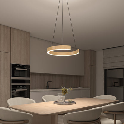A modern kitchen and dining area with light wood cabinets, a built-in oven, a minimalist round dining table for four, and the Artika-CAN-dev Vance modern LED pendant light 3 CCT with adjustable white shades hanging above the table.