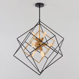 A modern geometric chandelier with black and gold cube frames intersecting, surrounding exposed vintage-style light bulbs, hanging from a black ceiling mount against a plain white background.