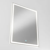 A rectangular wall-mounted mirror with an illuminated LED border and a small touch sensor button at the bottom center, set against a plain white background.