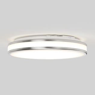 The Artika Hemisphere 15 in. LED flush mount light features sleek silver trim and 5 selectable color temperatures, offering bright, adjustable white light—perfect for modern bathroom lighting on a plain white ceiling.