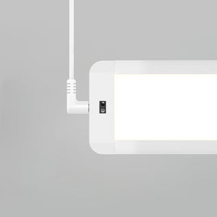 A close-up of the Artika Maestro under cabinet LED light 3CCT, a modern rectangular white fixture suspended by a white cord against a plain light gray background.