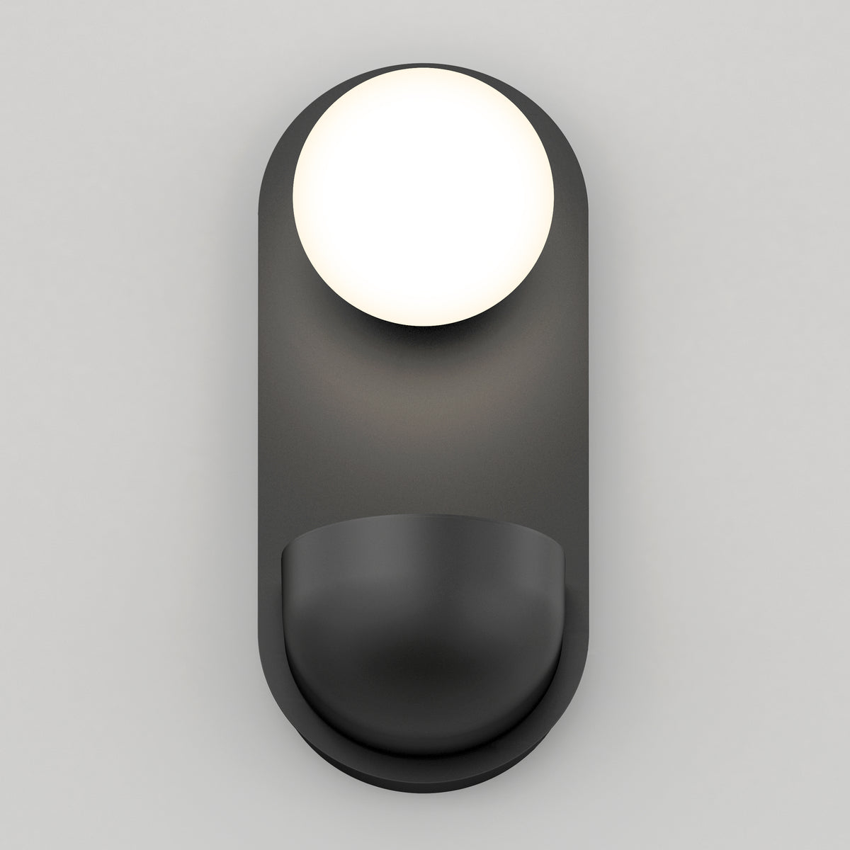 A modern, minimalist wall sconce with a round white light at the top and a curved, dark gray base against a light gray background.