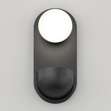 A modern, minimalist wall sconce with a round white light at the top and a curved, dark gray base against a light gray background.