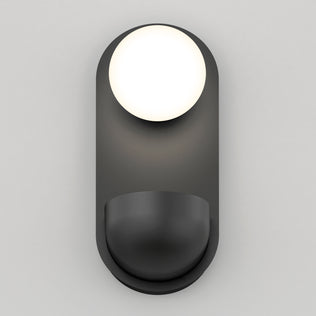 The Artika Bloomfield LED modern mid-century wall sconce 5 CCT features a round white bulb atop a curved, matte black base, wall-mounted against a plain light gray background.
