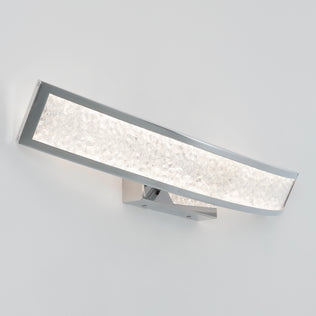 The Artika Glitter 27-in (69 cm) Integrated LED Vanity Light Bar features a textured illuminated glass panel and a sleek, slightly curved chrome frame, shown mounted on a plain white wall.