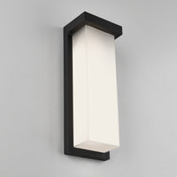 The Artika Skeet LED indoor-outdoor light features a modern rectangular frosted white shade and a sleek black frame, shown mounted on a light gray wall.
