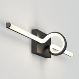 A modern wall sconce with a black rectangular base and a sleek, curved LED light fixture forming a loop design, mounted on a plain white wall.