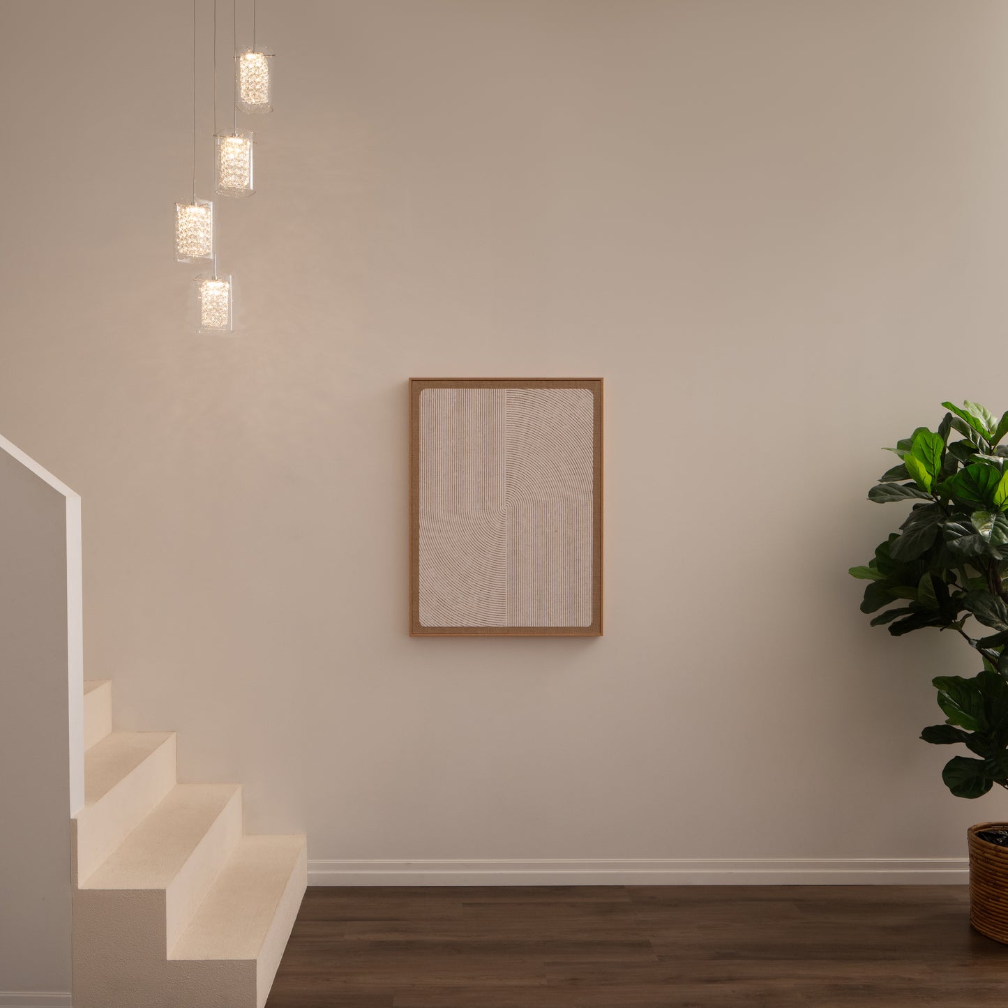 A minimalist interior featuring white stairs, a beige wall, a rectangular textured artwork, a wooden floor, a large potted plant in the corner, and Artika’s Crystal Cube 4-light LED pendant lights hanging from the ceiling.