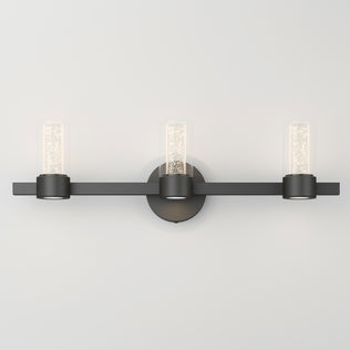 Artika Novello modern LED bathroom vanity light with cylindrical glass shades, shown mounted on a white wall.