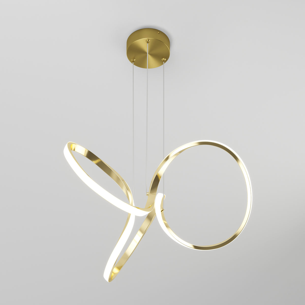 The Swirl LED pendant light by Artika features intertwined gold rings suspended from a round gold ceiling mount, providing energy-efficient modern lighting.