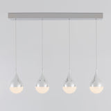 A modern pendant light fixture with four teardrop-shaped, chrome-finished lamps hanging in a row from a rectangular ceiling mount. The lower halves of the lamps emit a soft, diffused light.