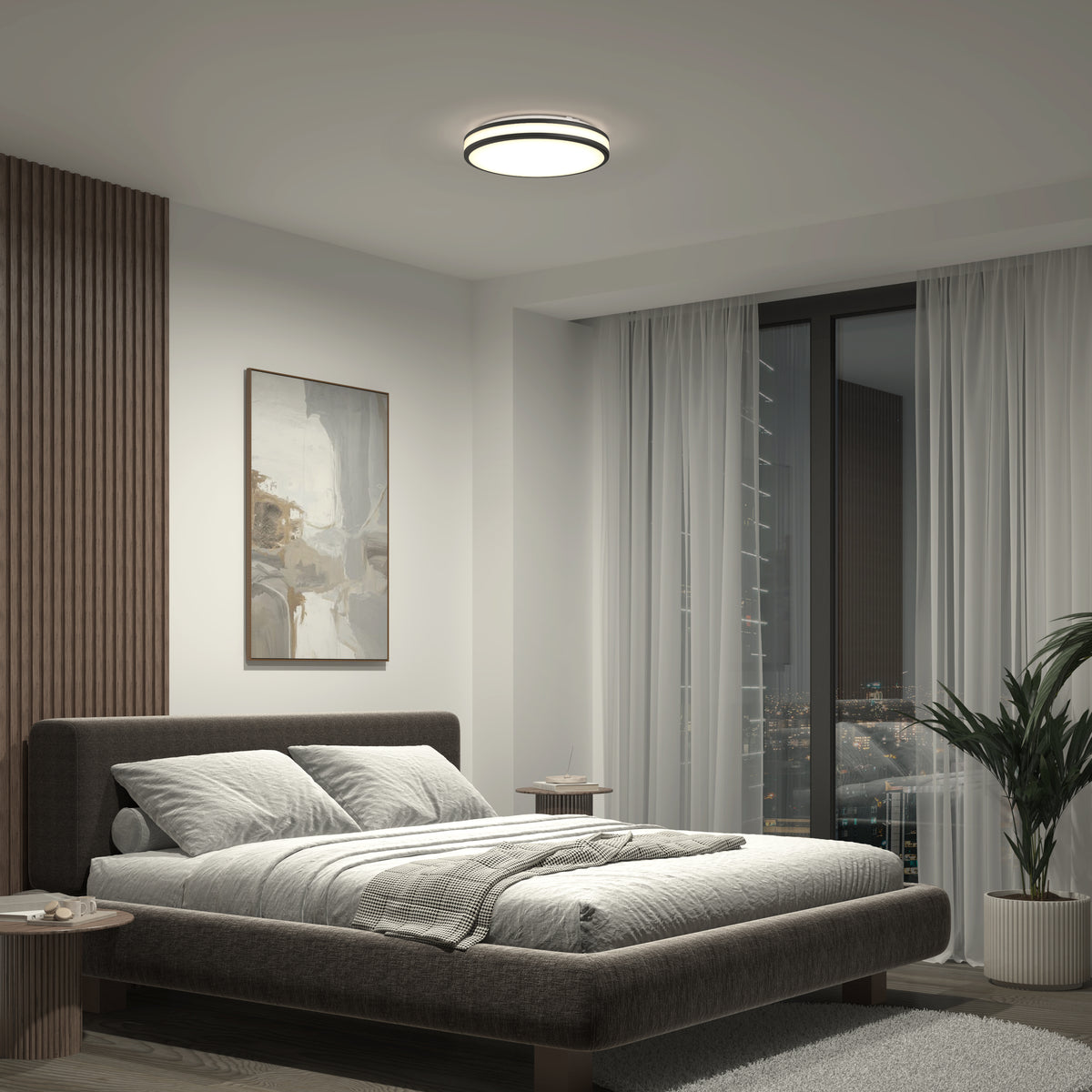 Modern bedroom featuring a large bed, abstract wall art, sheer floor-to-ceiling curtains, potted plant, and minimal furniture, lit by the Artika Hemisphere 15 in. LED flush mount light 5 CCT with adjustable brightness.
