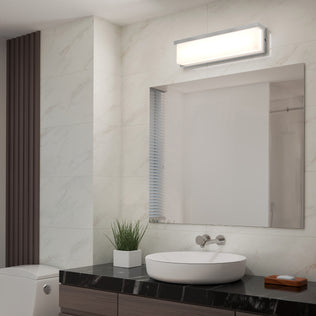 Modern bathroom with a large mirror, round sink, potted plant, and Artika Bristol modern LED vanity light above the mirror.