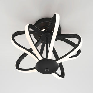 The Artika Meridian LED flush mount light features black curved arms and integrated white LED strips in a star-like geometric design, mounted on a white ceiling.