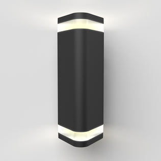 The Artika Trygon indoor-outdoor wall light is a modern black sconce with a rectangular design and rounded edges, emitting white light from both the top and bottom, shown mounted on a plain white wall.