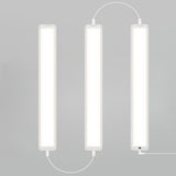 Three rectangular LED light panels are vertically aligned side by side on a gray background, connected by white cables.