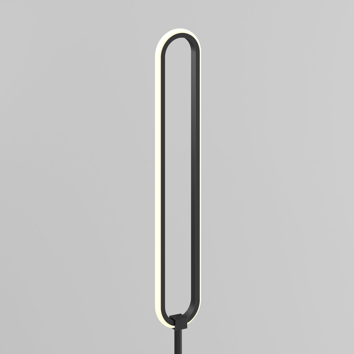 A modern, minimalist floor lamp with an elongated oval shape and a thin, black frame. The inner edge of the oval emits a soft, even light against a plain gray background.