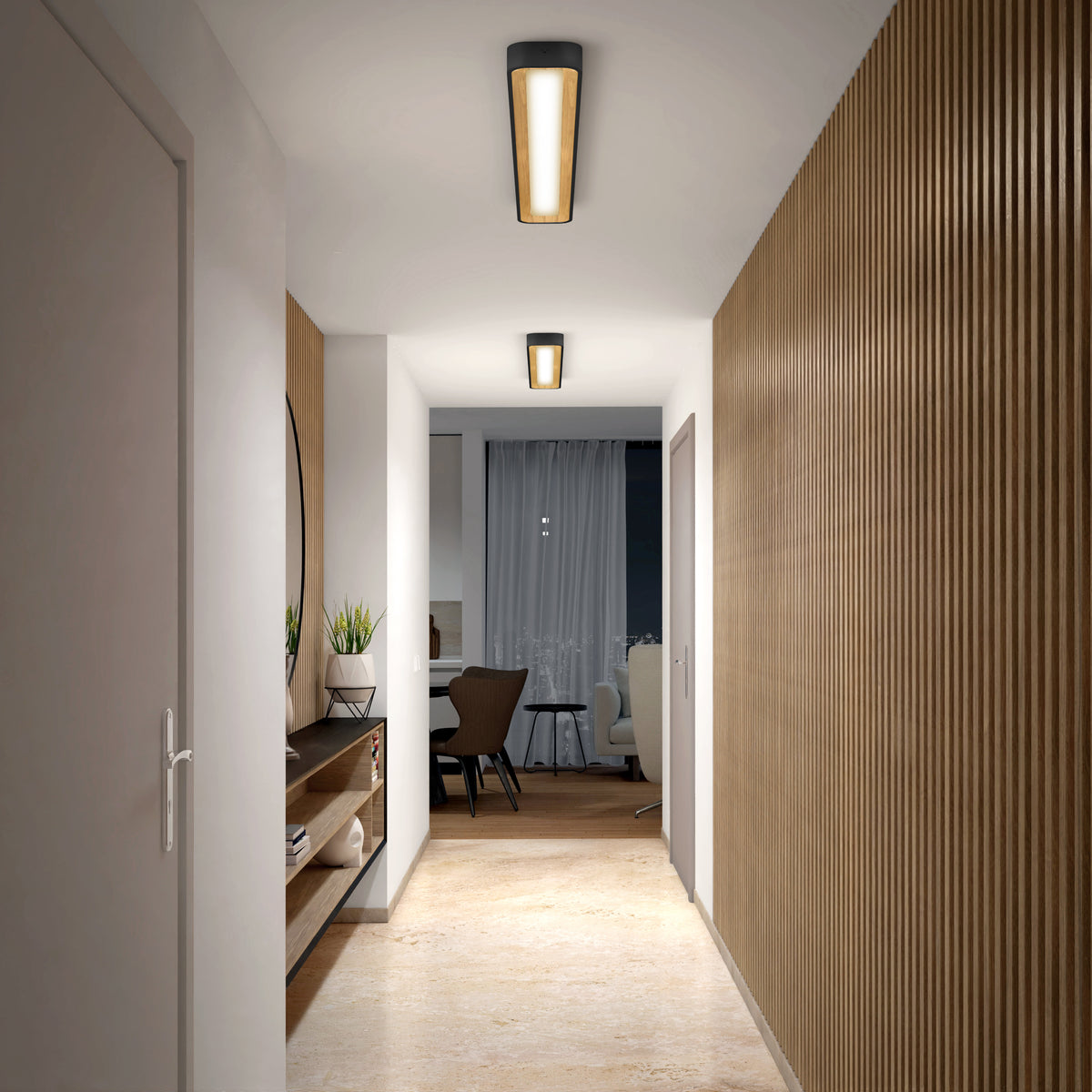 A modern hallway with wooden floors and slatted wood panels is lit by the Artika Alton 48 in. LED flush mount light. A side shelf holds plants and decor, leading to a dining area with dark chairs and a round mirror.