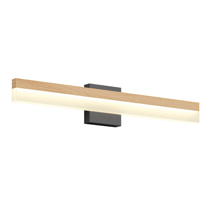 The Artika Neil modern LED bathroom vanity light features a long, rectangular wooden frame, a frosted light panel, and a black rectangular wall-mounted base.