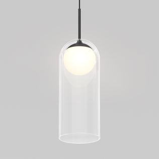 The Artika Mirah LED modern mid-century pendant light 3 CCT features a clear cylindrical glass shade with a glowing white bulb, suspended by a black cord against a light gray background.