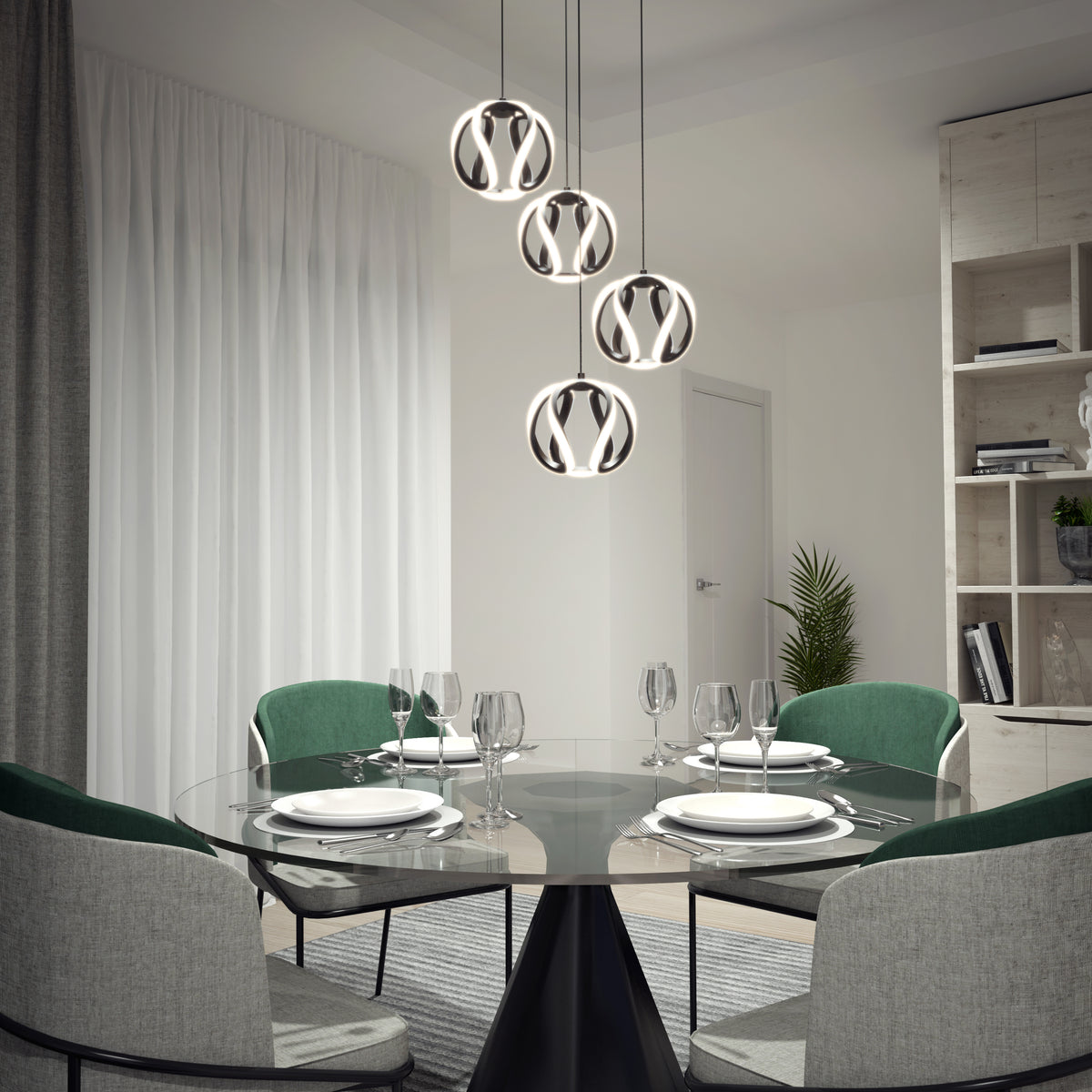 A modern dining room with a round glass table set for four, green and gray chairs, and five contemporary pendant lights hanging above. White curtains, a bookshelf, and a potted plant are in the background.