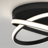 A modern ceiling light fixture with two intertwined circular LED rings, one illuminated and one dark, mounted on a round black base.