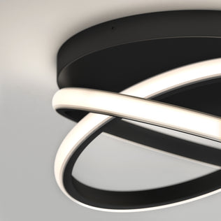 The Artika Orbia modern LED flush mount light 3 CCT features two intersecting LED rings on a round black base, mounted on a white ceiling.