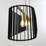A modern pendant light fixture with three exposed bulbs, brass-colored fittings, and a black geometric cage-like frame, set against a plain light background.