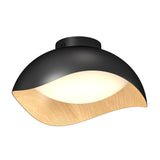 A modern ceiling light fixture with a black and natural wood wave-shaped shade, featuring a diffused white light at the center.