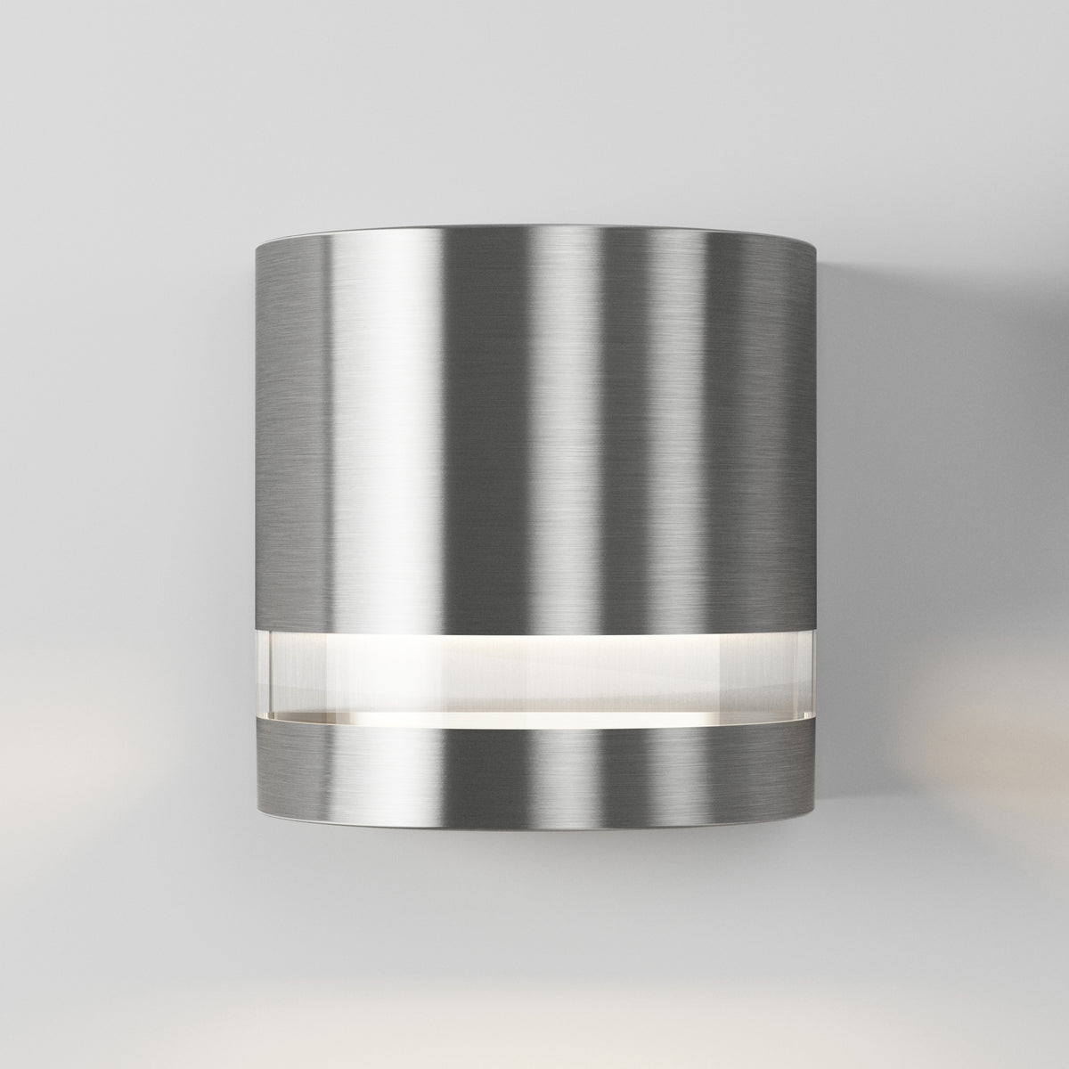 The Artika Valor Round LED wall light features a brushed metal finish and a horizontal strip near its base for modern style.