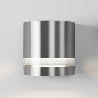 The Artika Valor Round LED wall light features a brushed metal finish and a horizontal strip near its base for modern style.
