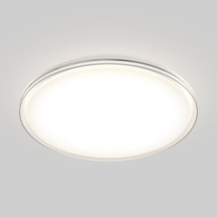 The Artika Astrid 16.5 in. LED flush mount light with remote emits a bright white glow against a light gray background.