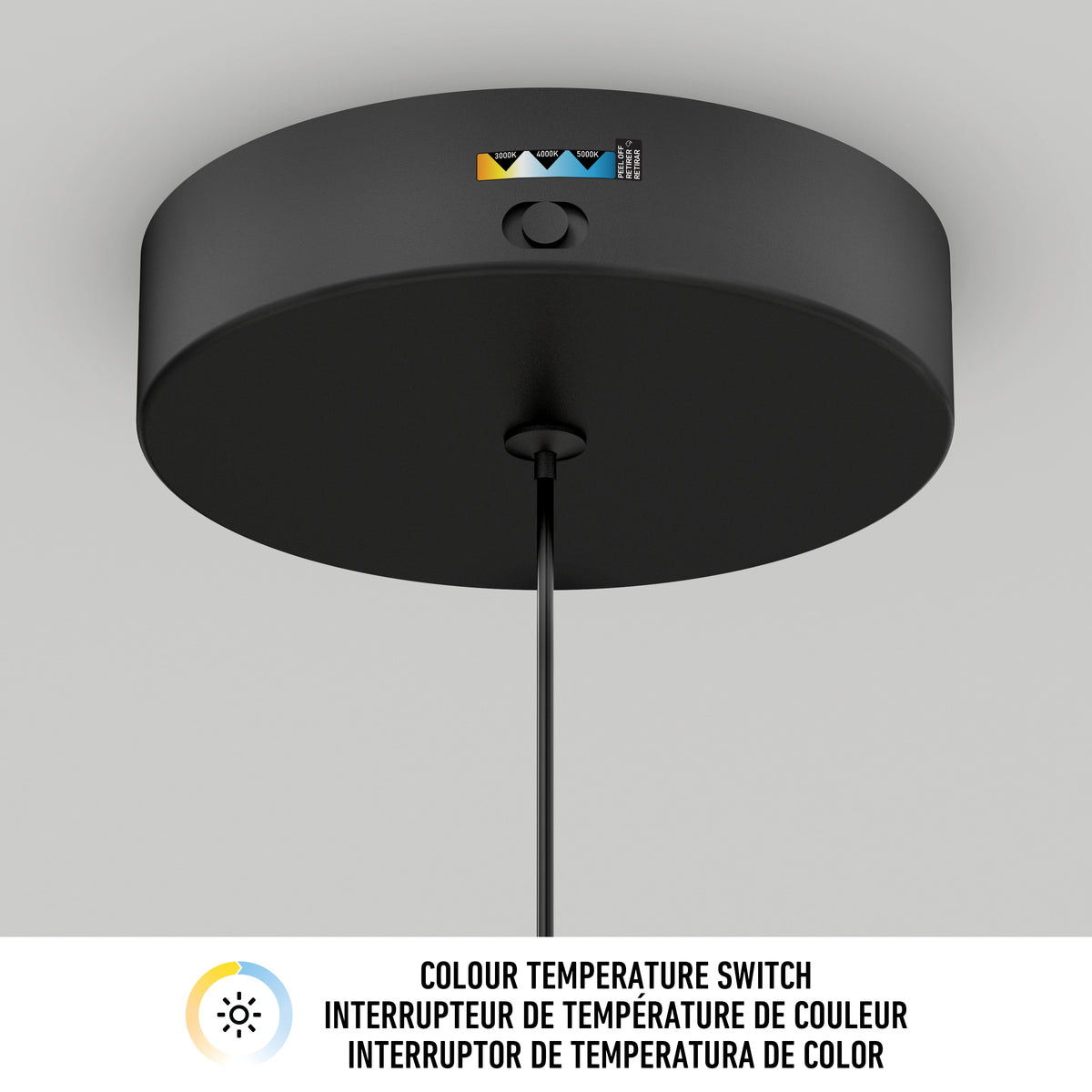 A close-up of a black ceiling light fixture with a color temperature switch. Below, there is a label with icons and text in English, French, and Spanish: Colour Temperature Switch.