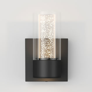 The Artika Essence 1-light LED bathroom vanity light features a black base and glass shade, ideal for modern accent lighting.